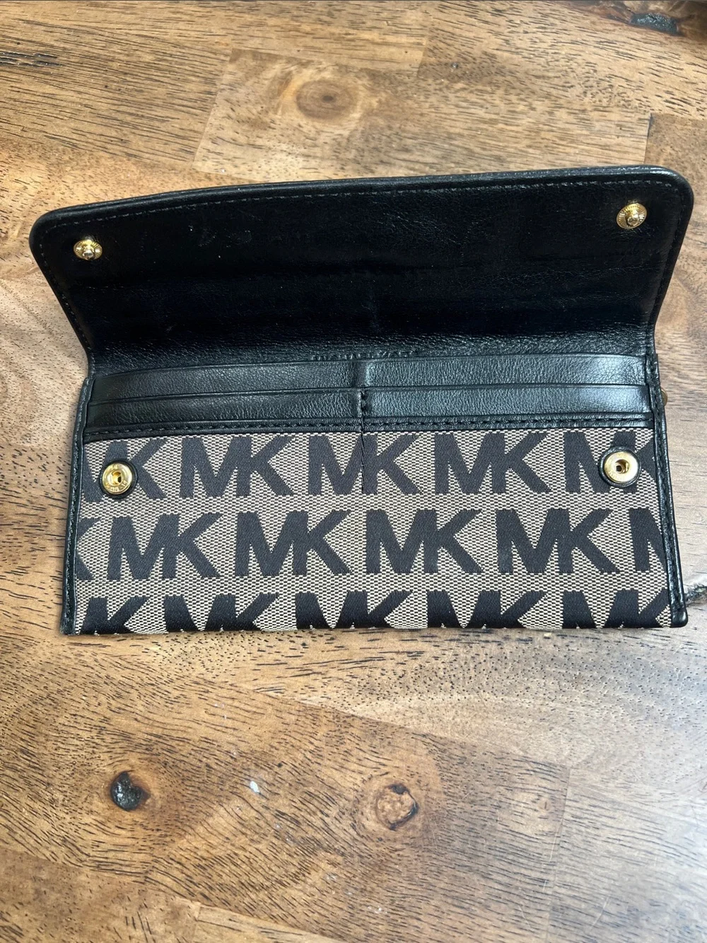 Michael Kors Black and Tan Logo Foldover Wallet with Gold Plaque
